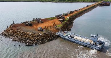 A Navy landing craft delivers disaster-relief supplies at Bekana Jetty in Vanua Levu, Fiji, during Operation Fiji Assist. Photo by Corporal Dustin Anderson.