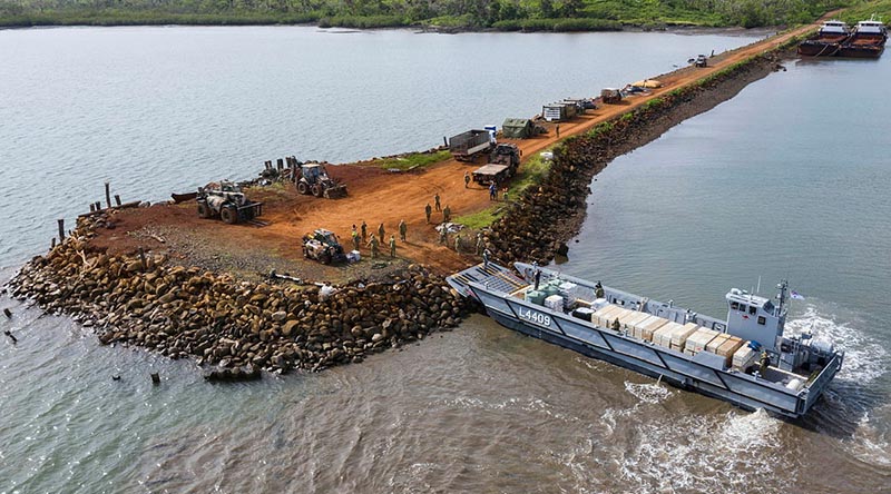 A Navy landing craft delivers disaster-relief supplies at Bekana Jetty in Vanua Levu, Fiji, during Operation Fiji Assist. Photo by Corporal Dustin Anderson.