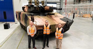 Minecorp Australia General Manager Angus McIntyre, Rheinmetall Defence Australia General Manager Land 400 Phase 3 Lee Davis and RDA Managing Director Gary Stewart with one of three Lynx now in Australia for assessment. Photo supplied.