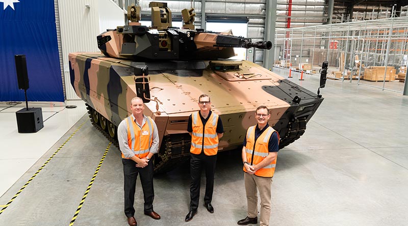 Minecorp Australia General Manager Angus McIntyre, Rheinmetall Defence Australia General Manager Land 400 Phase 3 Lee Davis and RDA Managing Director Gary Stewart with one of three Lynx now in Australia for assessment. Photo supplied.