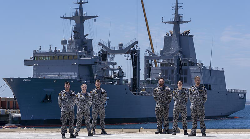 Marine Technicians Able Seamen Greg Hallet, Cassandra Bullock, Mason Turner, Cody Martin, Yassi Coban and Leading Seaman Morse Stanton in front of NUSHIP Supply at Fleet Base West, Western Australia. Photo by Leading Seaman Ronnie Baltoft.