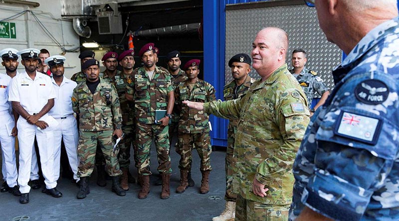 Major General Roger Noble welcomes members of the Sri Lankan Navy aboard HMAS Canberra at Colombo, Sri Lanka, during Indo-Pacific Endeavour 2019. Photo by Leading Seaman Steven Thomson.