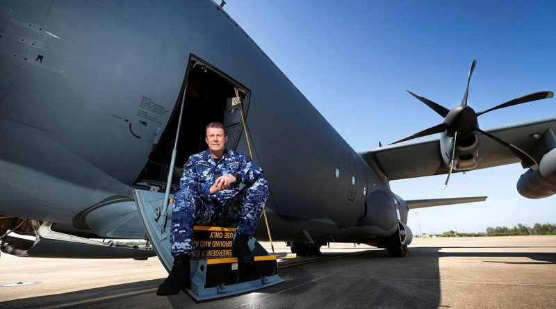 Specialist Reserve Public Affairs Officer Wing Commander Peter Overton on the steps of a No. 37 Squadron C-130J Hercules. Photo by Corporal David Said.