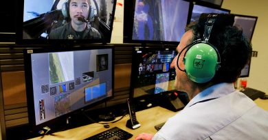 Simulator Pilot Instructor Ben Scorey, of Canadian Aviation Electronics, monitors and instructs Pilot Officer Alec Taylor in the Hawk 127 Simulator during a trial of eye tracking technology. Photo by Corporal Brett Sherriff.