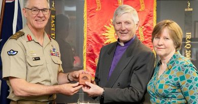 Chief of Army Lieutenant General Rick Burr presents a Federation Star to Bishop Grant Dibden alongside his wife Janet at Russell Offices, Canberra. Photo by Petty Officer Lee-Anne Cooper.