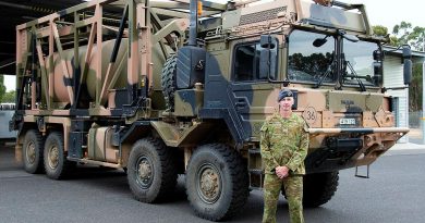 Warrant Officer Class 2 Lance Keighran in front of a MAN HX77 truck at the Army School of Transport in Puckapunyal, Victoria. Photo by Corporal William Spence.