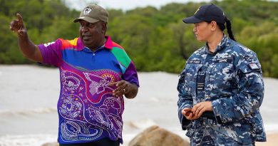 Indigenous Liaison Officer Flight Lieutenant Kristal House engages with Deputy Chair of the Kauareg Native Title Elizah Wasaga on the King's Point beach at Ngurupai (Horn Island) in the Torres Strait. Photo by Corporal Jesse Kane.