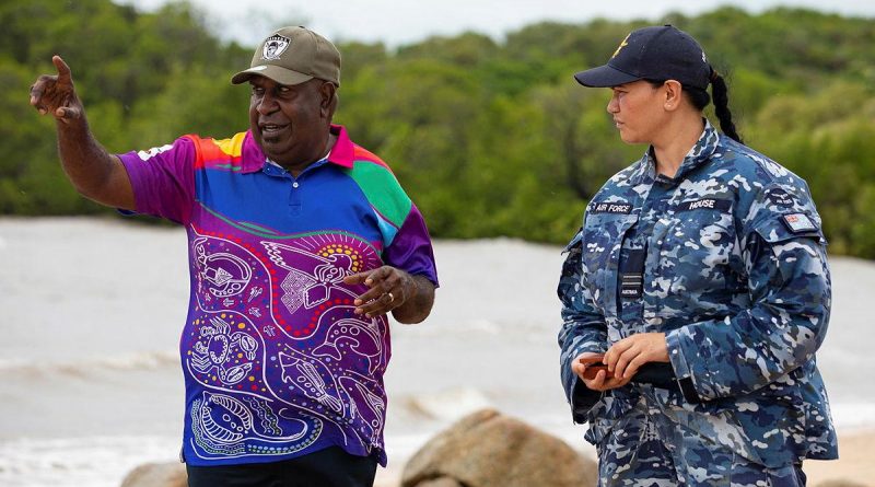 Indigenous Liaison Officer Flight Lieutenant Kristal House engages with Deputy Chair of the Kauareg Native Title Elizah Wasaga on the King's Point beach at Ngurupai (Horn Island) in the Torres Strait. Photo by Corporal Jesse Kane.