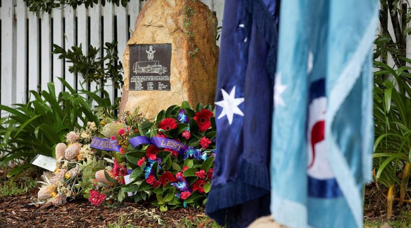 Wreaths surround the memorial plaque at the rededication service commemorating the 80th anniversary of the RAAF Anson A4-5 crash at Glenbrook, NSW. Photo by Corporal Kylie Gibson.