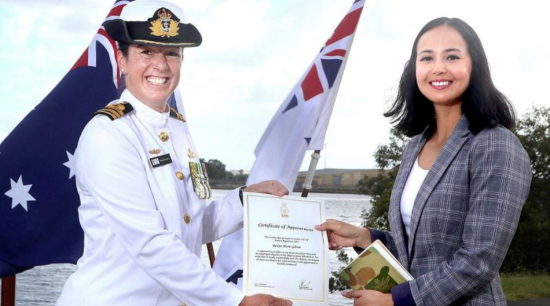 Commanding Officer HMAS Moreton Commander Phillipa Hay appoints Roslyn Gibson to the Royal Australian Navy during a ceremony in Brisbane.