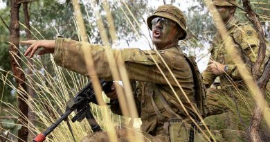 Army Officer Cadet Lachlan Goodall gives orders during a section attack at the Majura Training Area. Photo by Corporal Robert Whitmore.