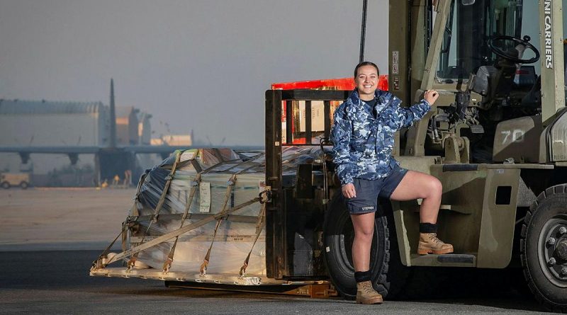 Leading Aircraftwoman Lisa Stephens prepares to load a C-130J Hercules in the Middle East region. Photo by Sergeant Ben Dempster.