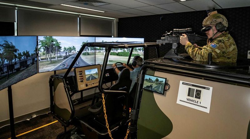 Forces Command Major Andrew Bone and Signaller Jon Taylor, rear, test the new Protected Mobility Tactical Training System at the Battle Simulation Centre, Gallipoli Barracks, Enoggera. Photo by Private Jacob Hilton.