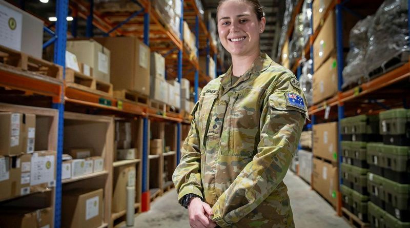 Lieutenant Madeline Meagher at the warehouse facility in the Middle East region. Photo by Sergeant Ben Dempster.