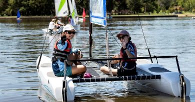 Aircraftwoman Ayumi Kono, left, and Aircraftwoman Samantha Shen enjoy a morning of sailing at Lake Burley Griffin, Canberra. Photo by Sergeant Janine Fabre.