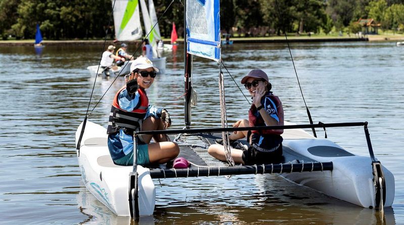 Aircraftwoman Ayumi Kono, left, and Aircraftwoman Samantha Shen enjoy a morning of sailing at Lake Burley Griffin, Canberra. Photo by Sergeant Janine Fabre.
