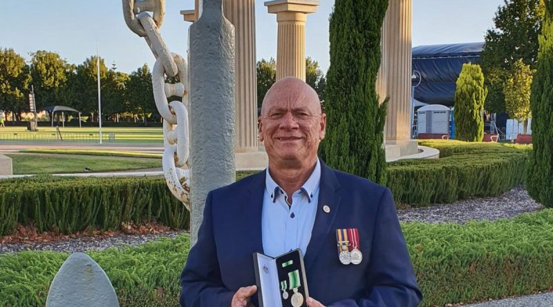 Former Chief Petty Officer Danny Joyce is awarded the Australian Service Medal at Anzac Park in Rockingham, Western Australia.