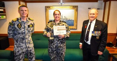 Commander Andrew Pepper with Able Seaman Melissa-Jane Bult and John Withers on board HMAS Hobart. Photo by Petty Officer Brendan Matchett.