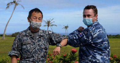 Chaplain Stuart Asquith shares a COVID-safe elbow tap with Warrant Officer Yoshiaki Tanide, of the Japan Air Self-Defense Force at Andersen Air Force Base in Guam. Photo by Technical Sergeant Jerilyn Quintanilla.