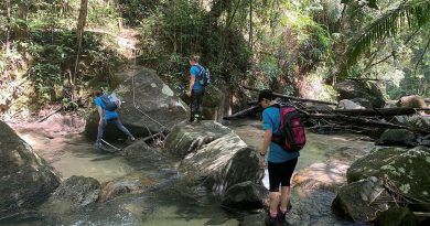 Greer Hawley, Flight Sergeant Sam Williams and Group Captain Gretchen Fryar hike through the hills of Pulau Pinang Malaysia to support the Rose Foundation.