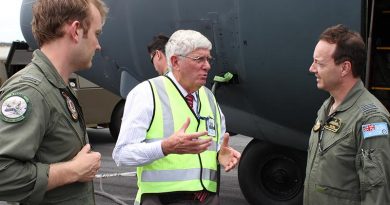 RAAF Museum Curator Dave Gardner speaks with Flying Officer Brett Aaker (left) and Squadron Leader Robert Sokol, pilots of the final C-130H Hercules flight to the RAAF Museum at Point Cook.