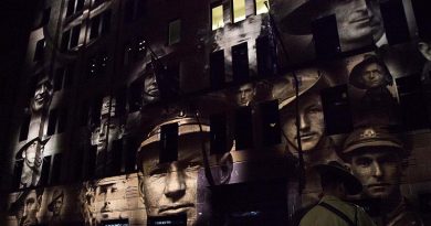Faces of Australian war veterans projected on a facade in Martin Place, Sydney, during an Anzac Day dawn service. Photo by Able Seaman Bonnie Gassner.