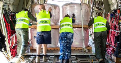 Air Force personnel unload fire retardant from a C-130J Hercules at Busselton Margaret River Airport in Western Australia. Photo by Leading Seaman Richard Cordell.