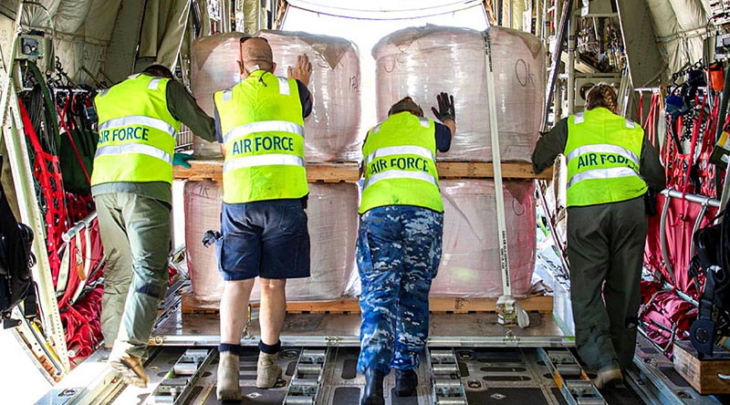 Air Force personnel unload fire retardant from a C-130J Hercules at Busselton Margaret River Airport in Western Australia. Photo by Leading Seaman Richard Cordell.