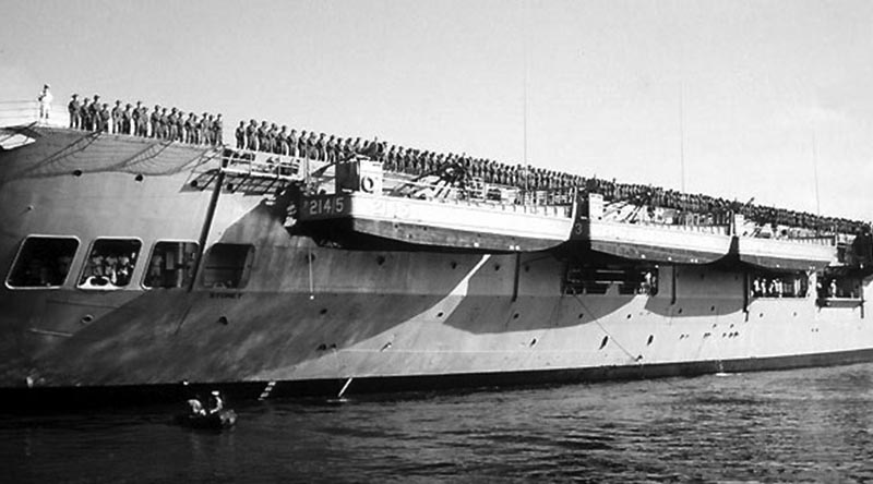 Australian troops bound for Vietnam line the flight deck of HMAS Sydney – the Vung Tau Ferry – on departure from Garden Island, Sydney.
