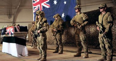 Snipers from Mentoring Task Force - Three form a guard around their recently fallen comrade, Private Matthew Lambert, at Tarin Kot, Afghanistan. Photo by Able Seaman Jo Dilorenzo.