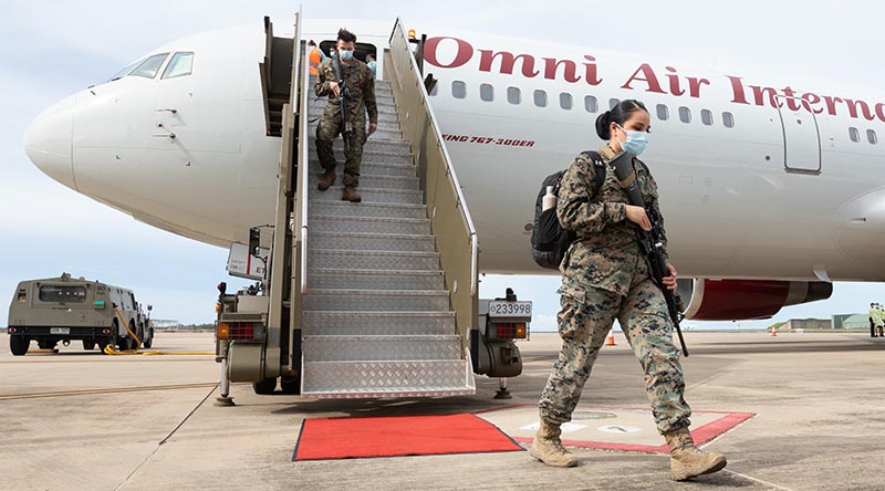 The first 2021 Marine Rotational Force - Darwin Marines, disembark their charter aircraft at RAAF Base Darwin, Northern Territory. Photo by Petty Officer Peter Thompson.