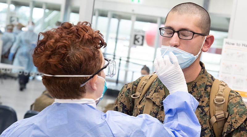 A US Marine with the 2021 Marine Rotational Force - Darwin is COVID-19 tested on arrival at RAAF Base Darwin. Photo by Petty Officer Peter Thompson.