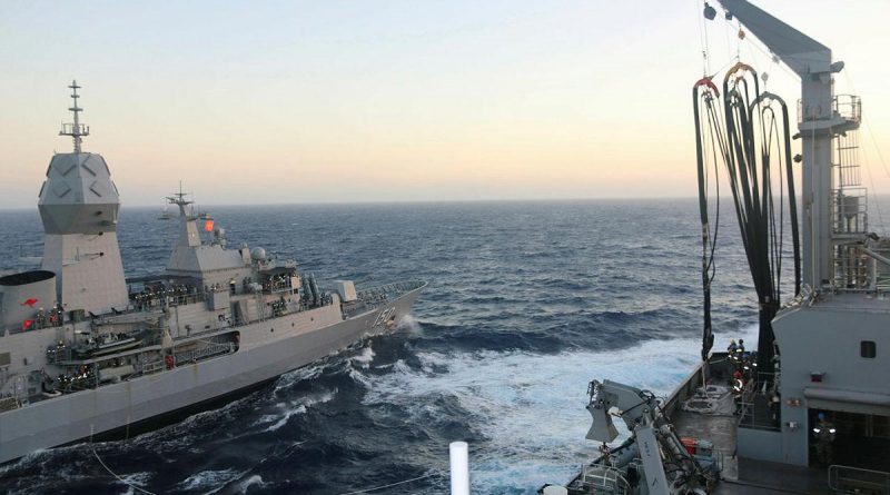 Navy frigate HMAS Anzac in company with HMAS Sirius during a replenishment at sea exercise off the coast of Western Australia.