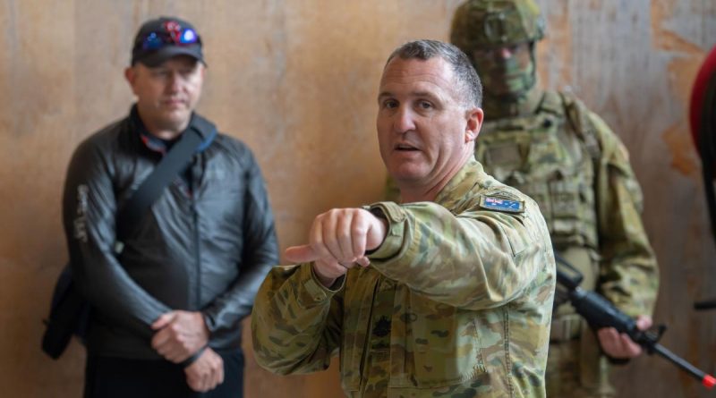 Regimental Sergeant Major Warrant Officer Class One Michael Carroll demonstrates urban clearing techniques to medical personnel during a visit to Gallipoli Barracks, Brisbane in 2020. Photo by Trooper Jonathan Goedhart.