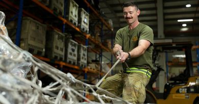 Private Mason Tessier secures cargo pallets in the warehouse of the ADF's main operating base in the Middle East, Camp Baird. Photo by Corporal Tristan Kennedy.