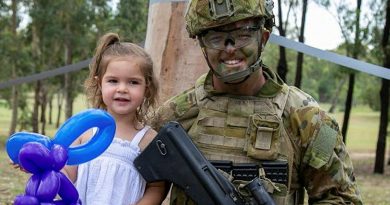 Private Jordan Enright, of the School of Infantry, enjoys the Singleton Military Area family day with his daughter. Photos by Corporal Shane Kelly.