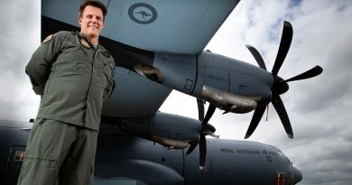 SQNLDR Michael Phillips with a No. 37 Squadron C-130J Hercules on the flightline at RAAF Base Richmond, NSW. Photo by CPL David Said.