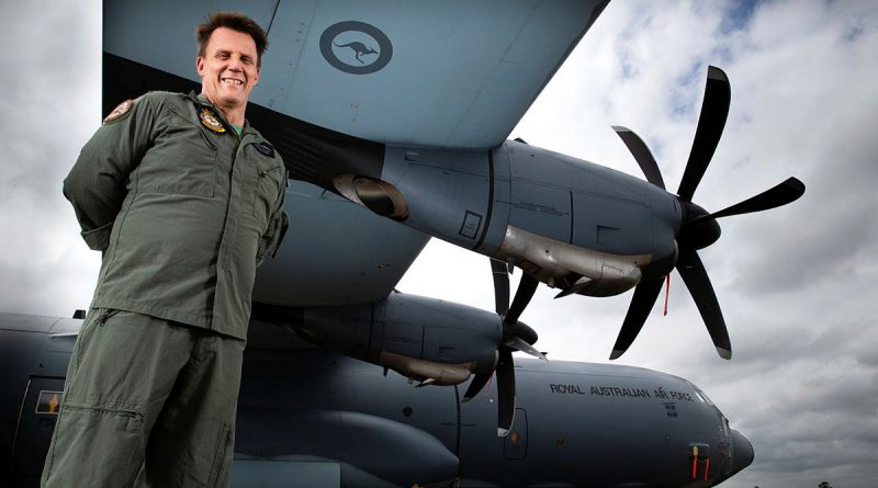 SQNLDR Michael Phillips with a No. 37 Squadron C-130J Hercules on the flightline at RAAF Base Richmond, NSW. Photo by CPL David Said.