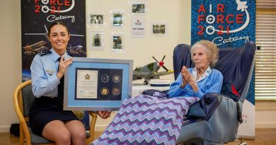 Leading Aircraftwoman Emma Singleton with the Chief of Air Force award presented to her great-grandmother Betty Howells to mark her 100th birthday. Photo by Sergeant Bill Solomou.