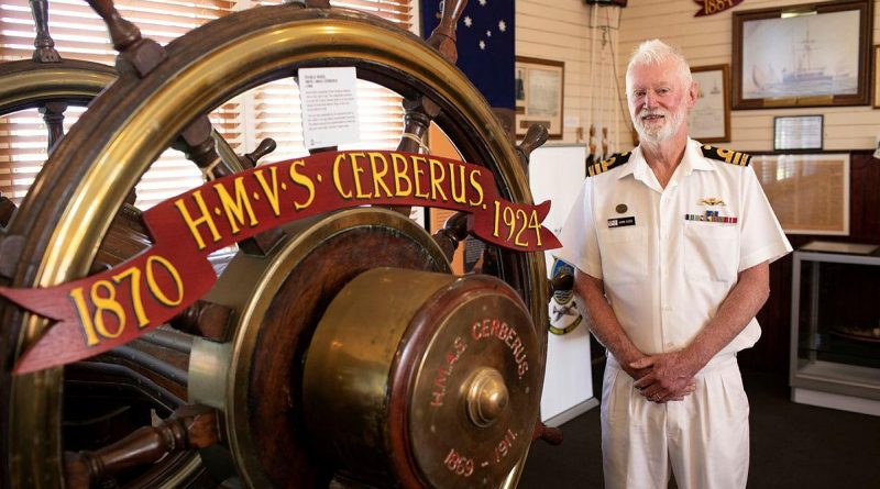HMAS Cerberus Museum Manager Commander John Goss with historic items from HMVS Cerberus in the HMAS Cerberus Museum in Westernport, Victoria. Photo by Leading Seaman Bonny Gassner.