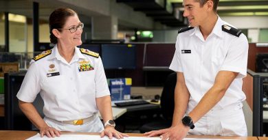 Director General Engineering - Navy Commodore Rachel Durbin speaks with Midshipman Jarad Barber at Campbell Park Offices in Canberra.