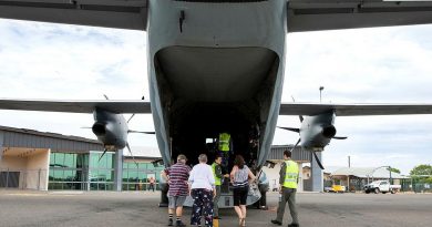 Flight Lieutenant Matthew Still, right, and Loadmaster Corporal Joanna Fletcher give residents a tour of a C-27J Spartan at Charleville Airport, Queensland. Photo by Leading Aircraftwoman Emma Schwenke.
