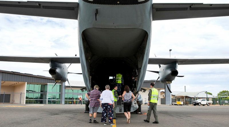 Flight Lieutenant Matthew Still, right, and Loadmaster Corporal Joanna Fletcher give residents a tour of a C-27J Spartan at Charleville Airport, Queensland. Photo by Leading Aircraftwoman Emma Schwenke.