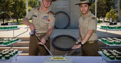 Chief of Army Lieutenant General Rick Burr, left, and Private Harrison Nguyen cut the cake during Army’s 120th birthday celebrations in Canberra. Photo by Sagi Biderman.