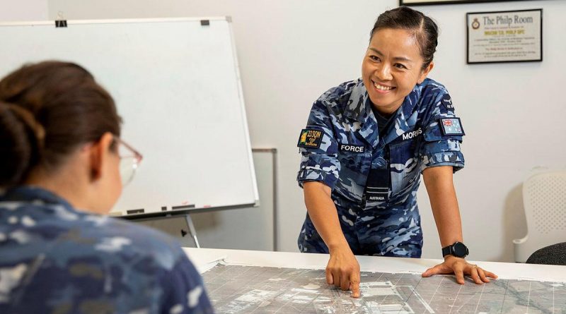 Flight Lieutenant Rachel Morris from No. 23 Squadron briefs her team on events around RAAF Base Amberley. Photo by Leading Aircraftwoman Emma Schwenke.