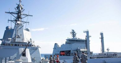 HMAS Hobart ship's company maintains the distance line during a replenishment-at-sea approach with Royal New Zealand Navy tanker HMNZS Aotearoa. Photo by Leading Seaman Ryan Tascas.