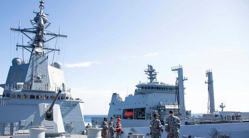 HMAS Hobart ship's company maintains the distance line during a replenishment-at-sea approach with Royal New Zealand Navy tanker HMNZS Aotearoa. Photo by Leading Seaman Ryan Tascas.