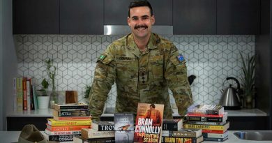 Captain Dylan Conway, of the 6th Battalion, Royal Australian Regiment, with books he read while bed-ridden after surgery. He later recommended books to others as part of his initiative, Brothers n' Books. Photo by Private Jacob Hilton.