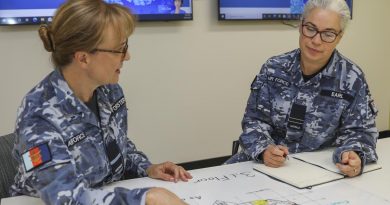 Air Commodore Margot Forster, left, with her sister Flight Lieutenant Melody Earl, at RAAF Base Edinburgh, South Australia, in the lead up to International Women's Day. Photo by Corporal Brenton Kwaterski.