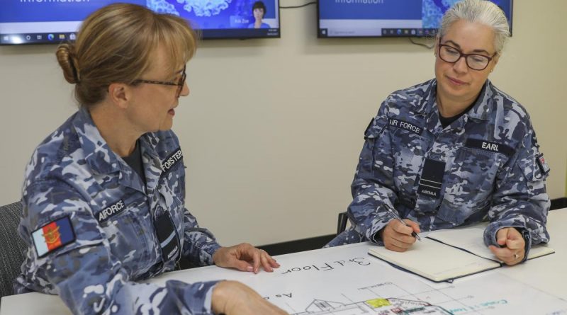 Air Commodore Margot Forster, left, with her sister Flight Lieutenant Melody Earl, at RAAF Base Edinburgh, South Australia, in the lead up to International Women's Day. Photo by Corporal Brenton Kwaterski.